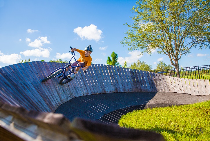 Kid riding on the BMX pump track in Bexley