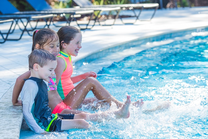 Kids splashing along side of the pool in Bexley.