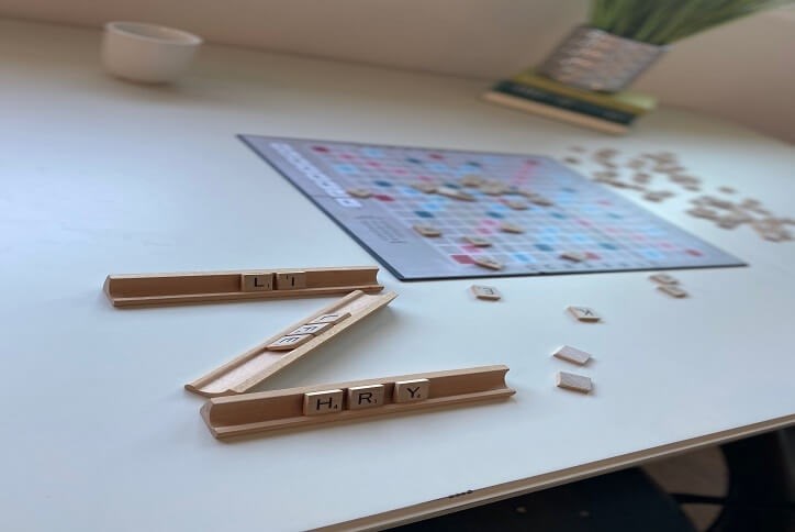 Scrabble board and wooden pieces on a table