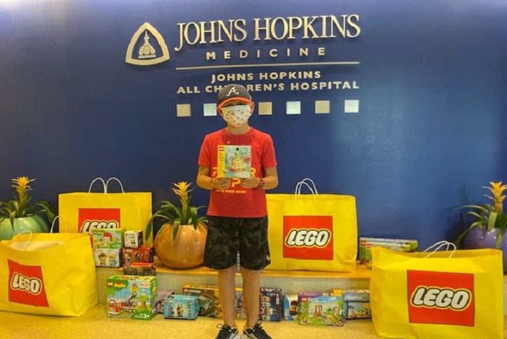 Julien at Johns Hopkins hospital with Lego collection